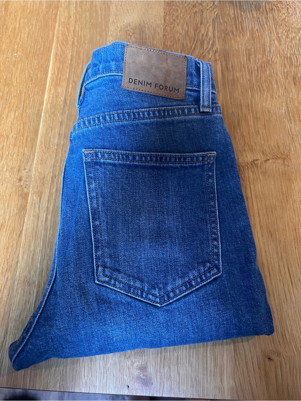 Denim Forum High-Rise Jeans in Blue with Brown Patch